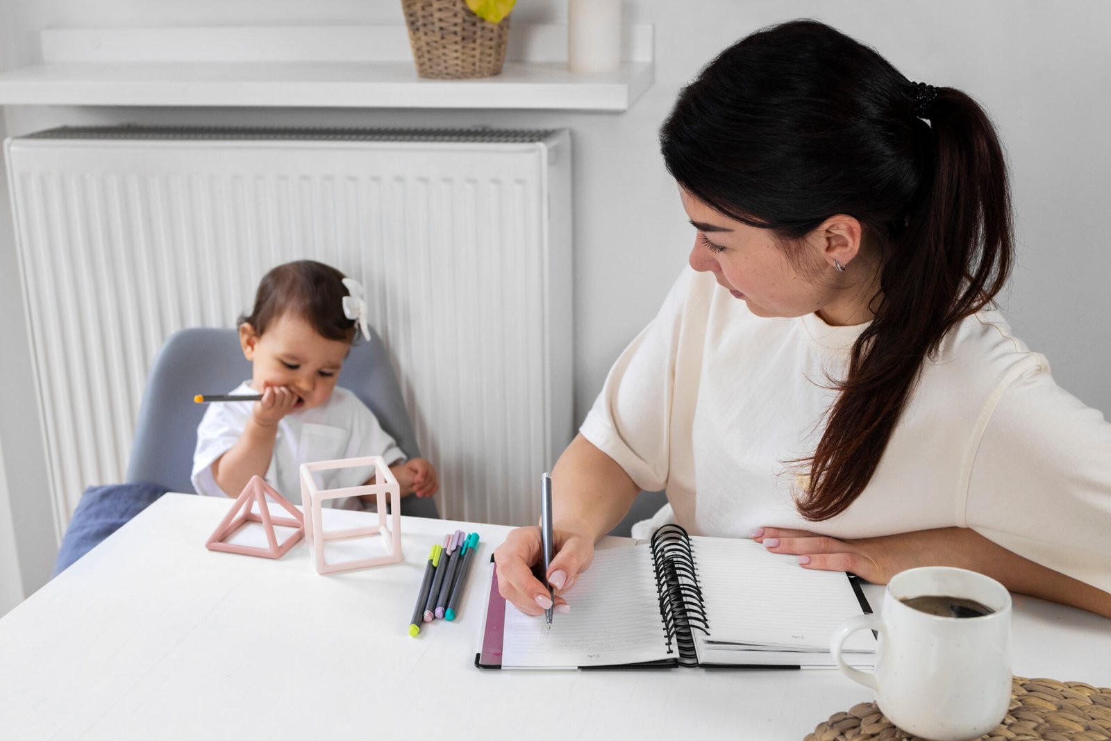 woman working with baby high angle scaled